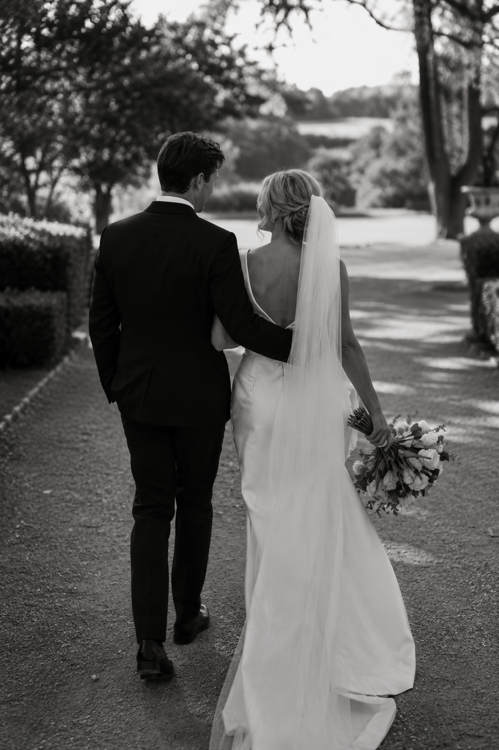 Newlyweds walking hand in hand